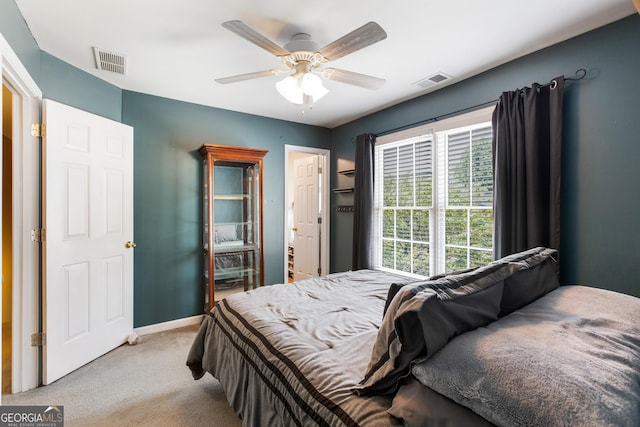 carpeted bedroom with ceiling fan