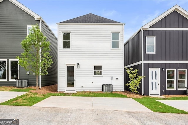 589 Federal Ter SE, Atlanta, GA 30315 - back of house featuring central air condition unit, board and batten siding, and roof with shingles