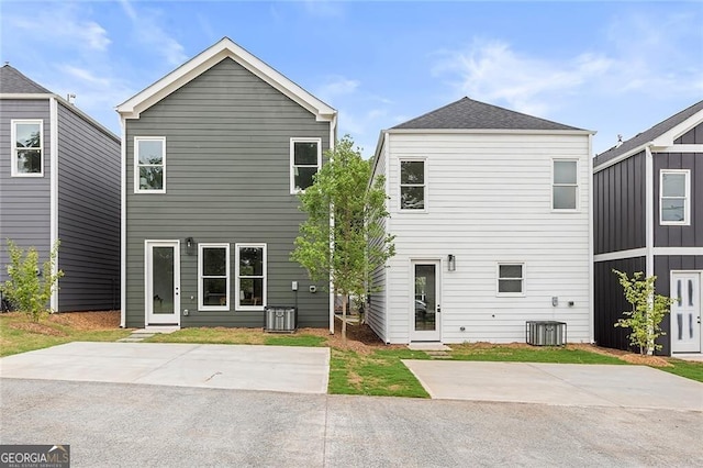 589 Federal Ter SE, Atlanta, GA 30315 - back of property featuring central AC and a shingled roof