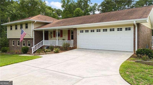 view of front of property featuring covered porch and a garage