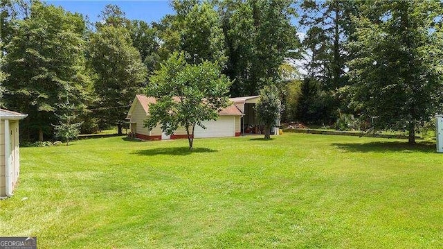 view of yard featuring a garage