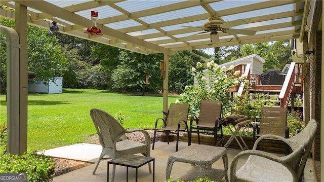 view of patio with a pergola and ceiling fan