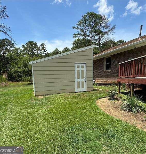 rear view of property with a lawn