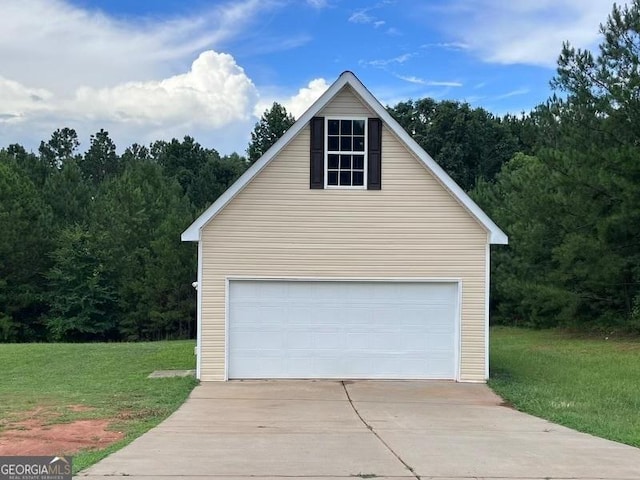 garage featuring a lawn