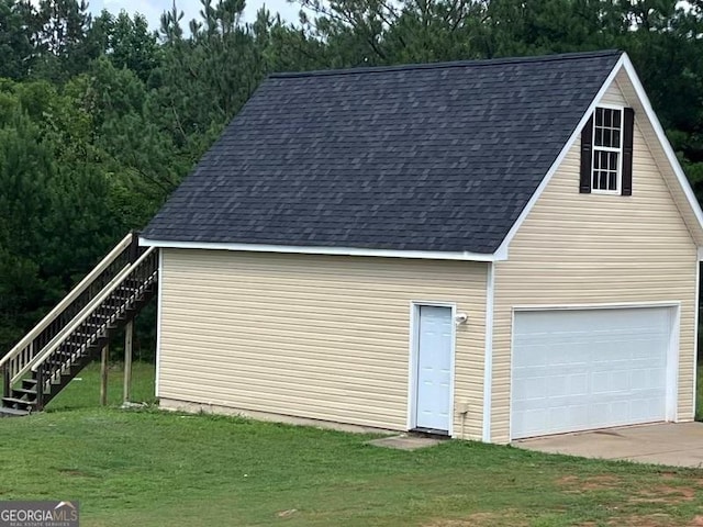 garage with a yard