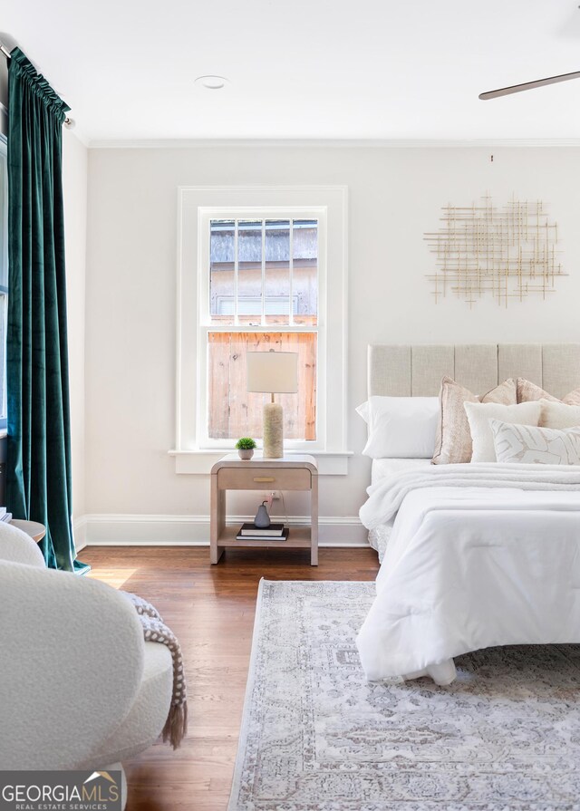 bedroom with wood-type flooring