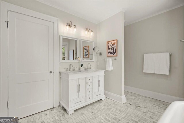 bathroom featuring vanity, ornamental molding, and a bath