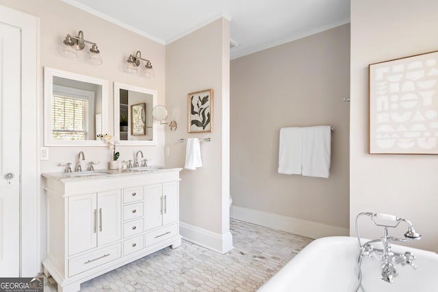 bathroom with crown molding, vanity, and a bathtub