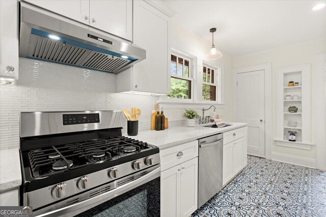 kitchen featuring tasteful backsplash, hanging light fixtures, white cabinetry, sink, and stainless steel appliances