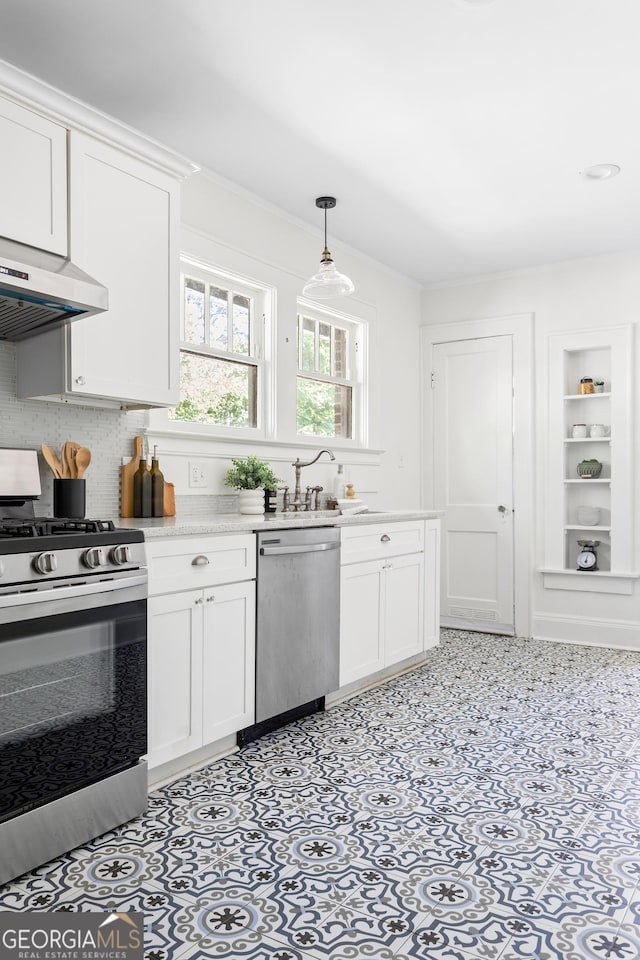 kitchen with range hood, sink, stainless steel appliances, and white cabinets