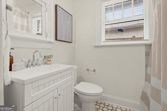 bathroom with vanity and toilet