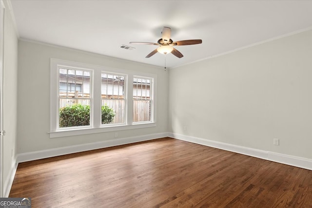 spare room featuring ornamental molding, wood-type flooring, and ceiling fan