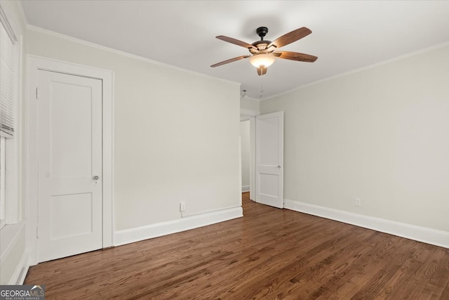 unfurnished bedroom with ceiling fan, ornamental molding, and dark hardwood / wood-style flooring