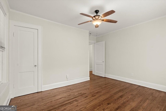 unfurnished room featuring crown molding, dark hardwood / wood-style floors, and ceiling fan