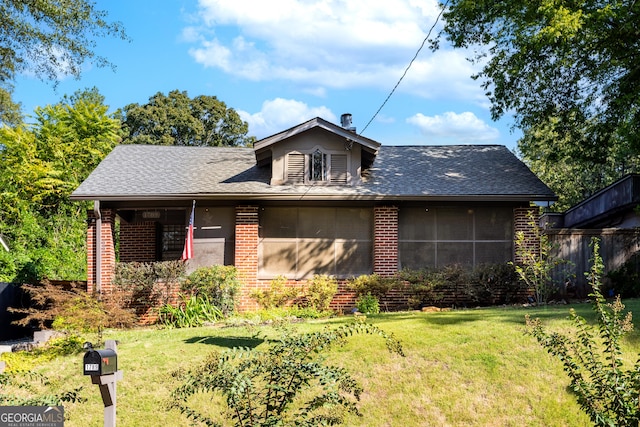 bungalow with a front yard