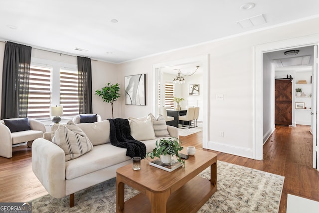 living room with ornamental molding and dark wood-type flooring