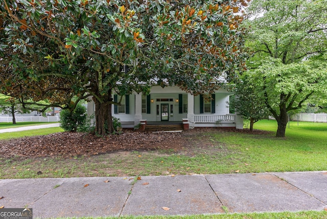99 W Main St, Gibson, GA 30810 - view of property hidden behind natural elements with a porch