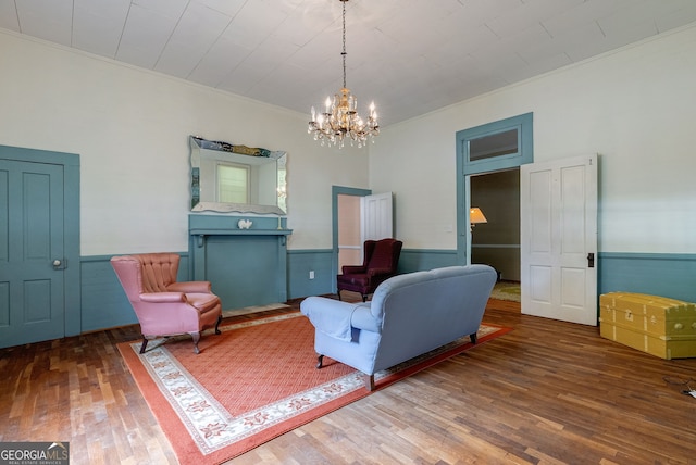99 W Main St, Gibson, GA 30810 - sitting room featuring a chandelier, hardwood / wood-style flooring, a wainscoted wall, and ornamental molding