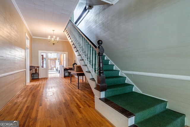 99 W Main St, Gibson, GA 30810 - stairs with a chandelier, hardwood / wood-style flooring, and crown molding