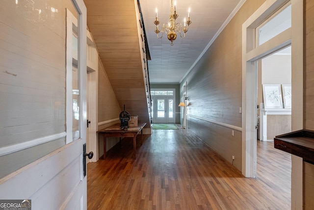 99 W Main St, Gibson, GA 30810 - foyer entrance featuring a chandelier, wood finished floors, and crown molding