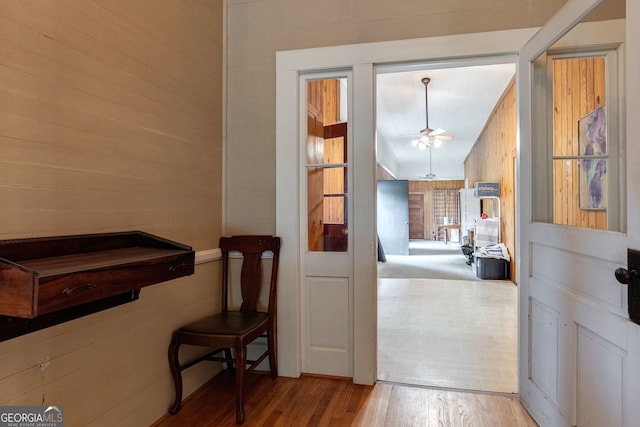 99 W Main St, Gibson, GA 30810 - corridor featuring wood finished floors and wood walls