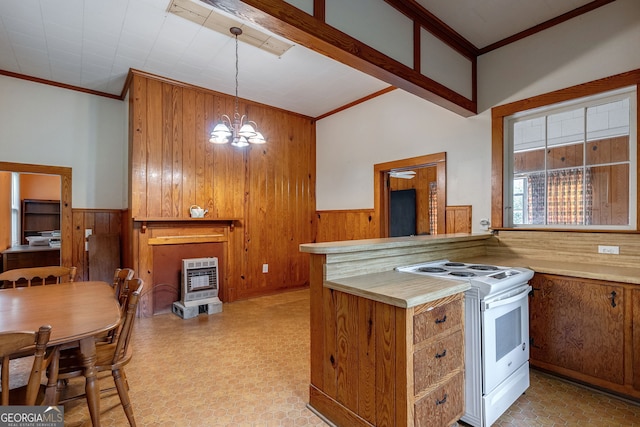 99 W Main St, Gibson, GA 30810 - kitchen featuring white range, ornamental molding, wood walls, brown cabinetry, and wainscoting