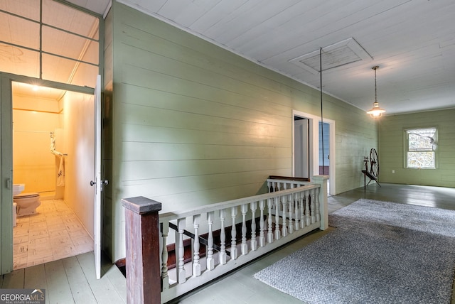 99 W Main St, Gibson, GA 30810 - hall featuring an upstairs landing, wood finished floors, and wooden walls