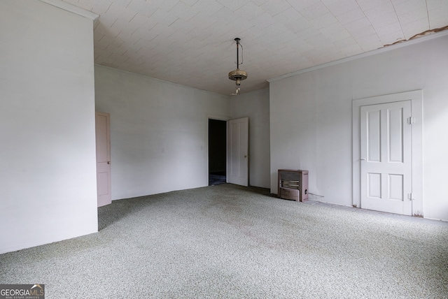 99 W Main St, Gibson, GA 30810 - spare room featuring carpet flooring and a wood stove