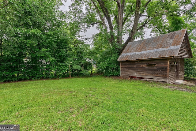 99 W Main St, Gibson, GA 30810 - view of grassy yard featuring a storage shed