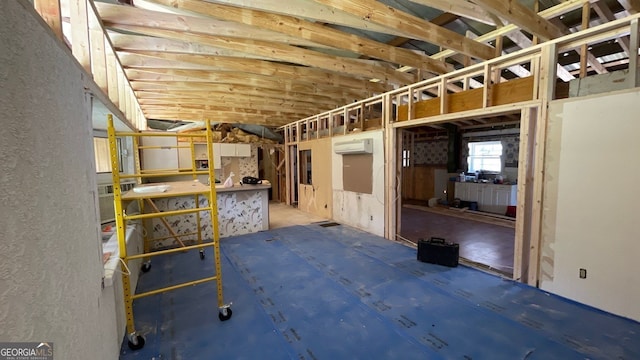 storage room featuring a wall mounted AC