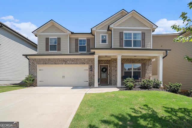 craftsman house featuring a garage and a front yard