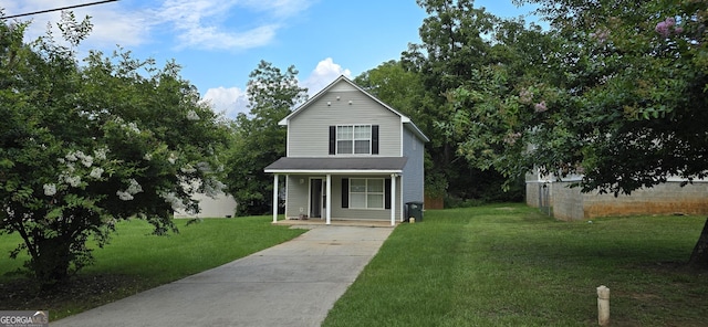 view of front of house with a porch and a front lawn