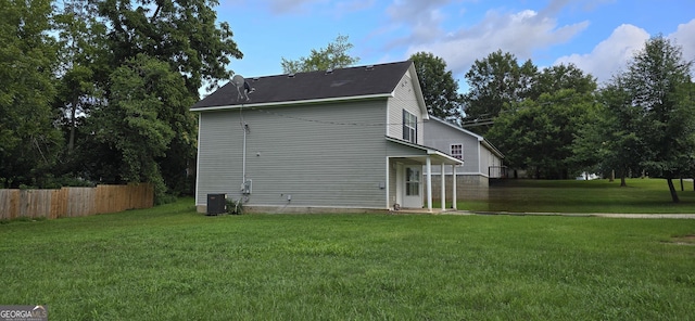 view of property exterior with a yard