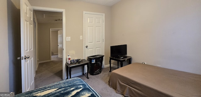 bedroom featuring light carpet