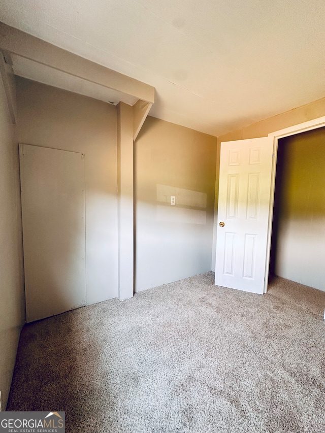 unfurnished bedroom featuring carpet flooring