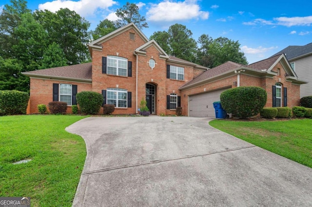 view of front property with a garage and a front lawn