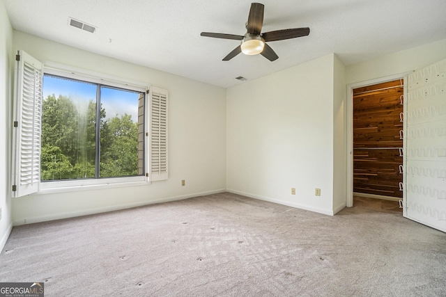 interior space with ceiling fan