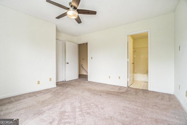 unfurnished room featuring light colored carpet and ceiling fan