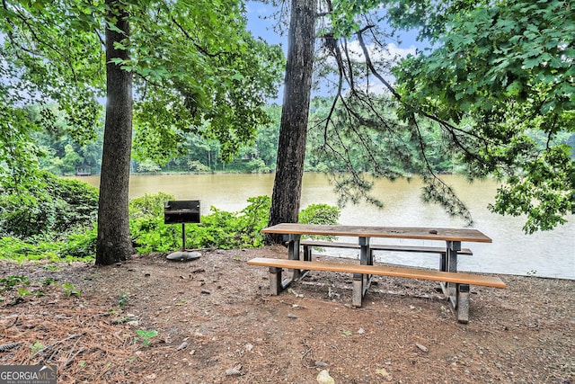 surrounding community featuring a water view