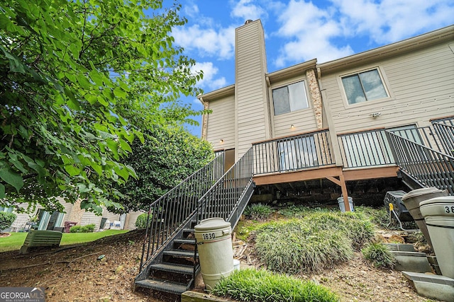 rear view of property with a deck