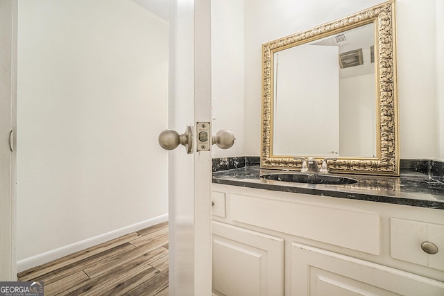 bathroom with wood-type flooring and vanity