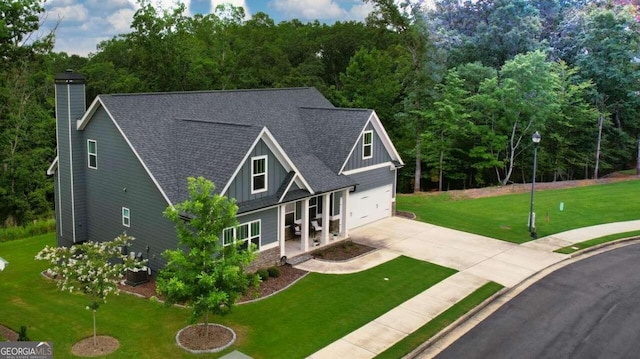 view of front of home featuring a garage and a front yard