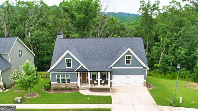 craftsman-style house featuring a garage and a front lawn