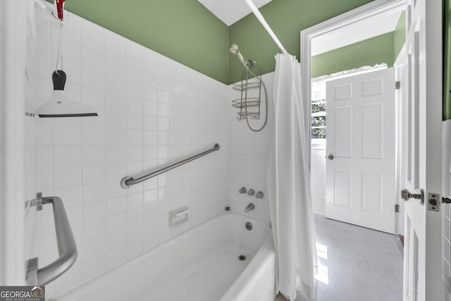 bathroom with shower / bath combo and tile patterned flooring