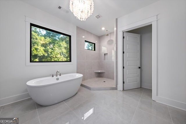 bathroom featuring separate shower and tub, tile patterned flooring, and a chandelier