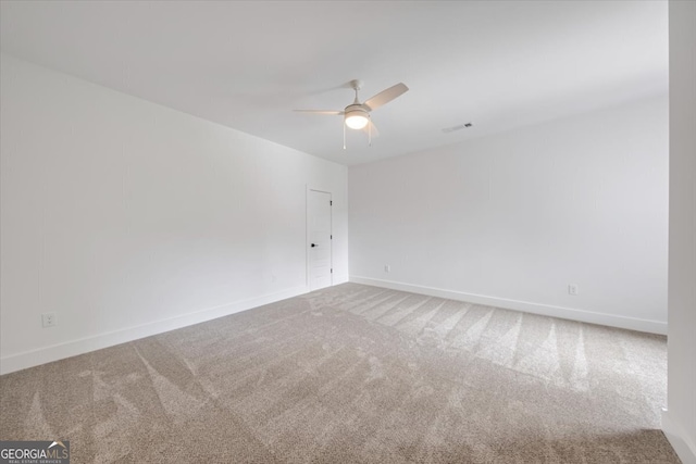 empty room with carpet floors and ceiling fan