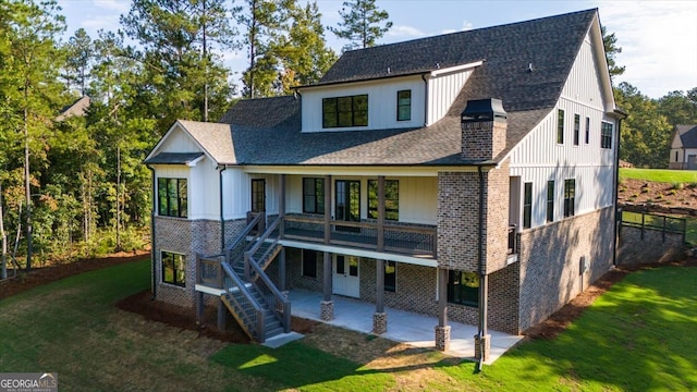 back of property featuring a yard and a patio area