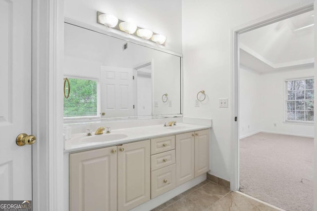 bathroom featuring vanity, plenty of natural light, and tile patterned floors