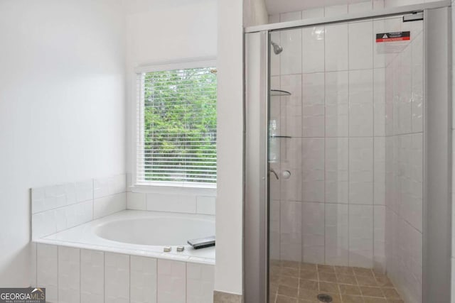 bathroom with shower with separate bathtub