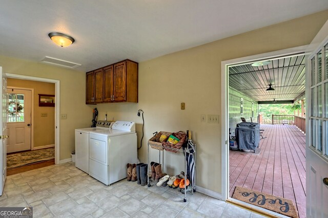 laundry area with cabinets and independent washer and dryer